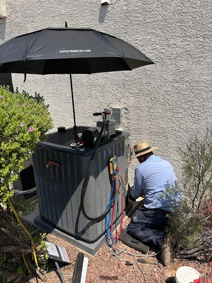 HVAC technician performing outdoor AC maintenance in Arlington Heights